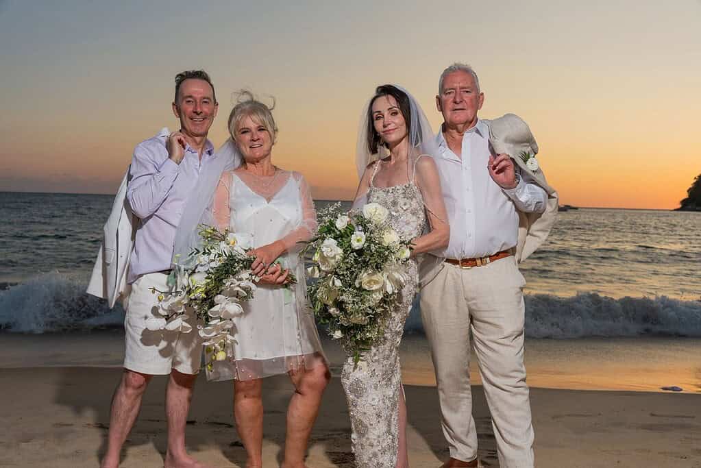 A private wedding vow renewal on a Phuket beach at sunset.